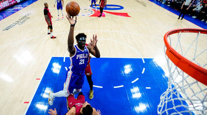 Philadelphia 76ers’ Joel Embiid goes up for a shot against Miami Heat’s Max Strus during the first half of Game 3 of an NBA basketball second-round playoff series, Friday, May 6, 2022, in Philadelphia.